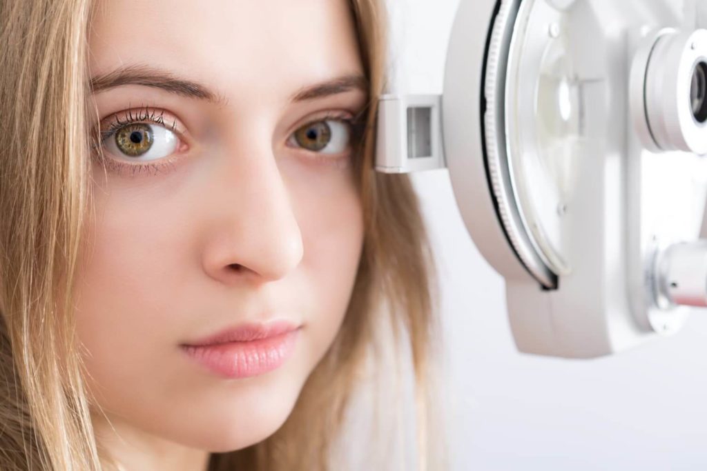 Woman getting eye exam
