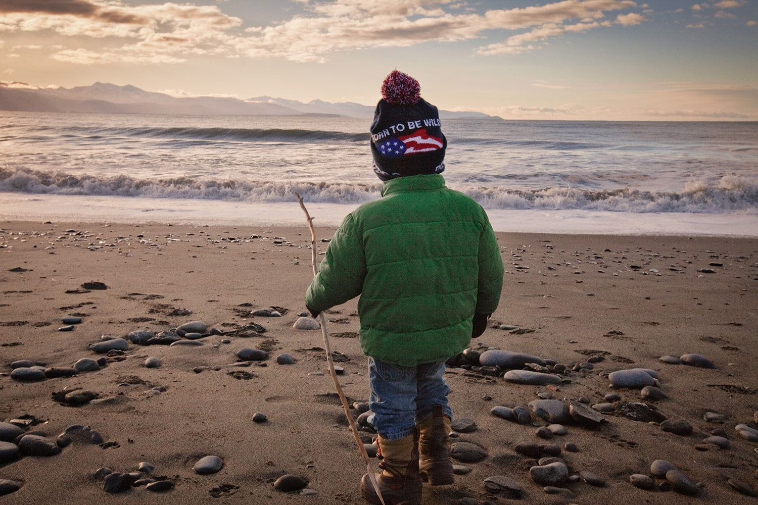 Child on a beach by the ocean