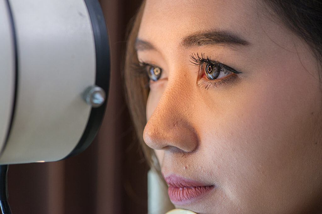 Woman getting eye exam